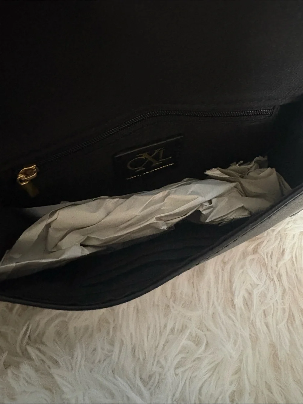Elegant Black Wristlet Clutch with Embossed Logo